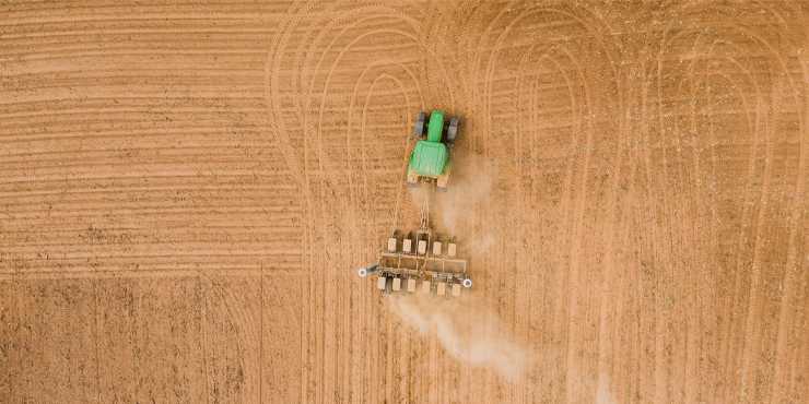 Birds eye view of a tractor plowing a field