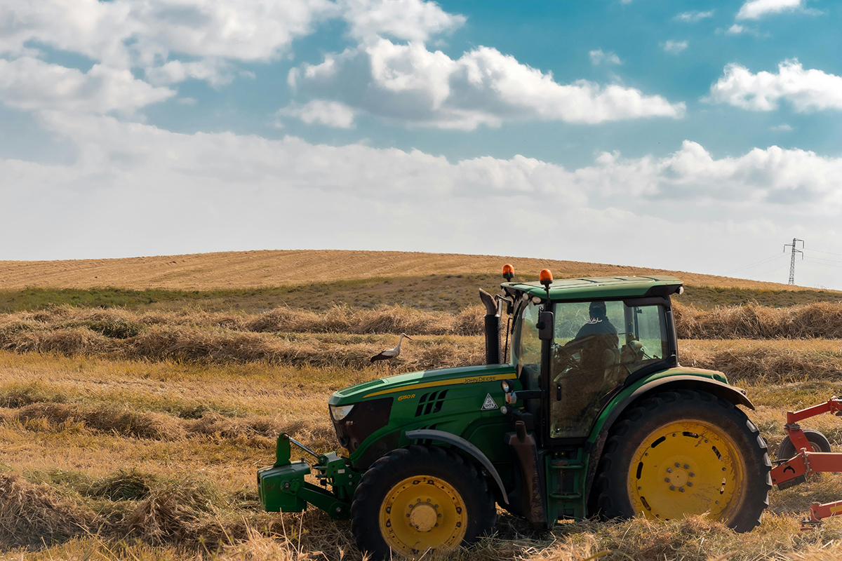 tractor harvesting hay