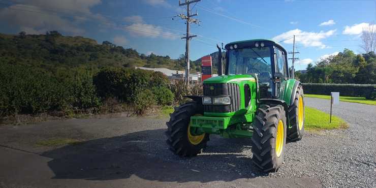 Tractor parked on a gravel patch
